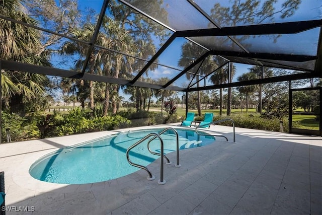 view of pool featuring a patio and glass enclosure