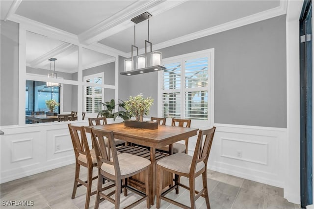 dining room featuring crown molding