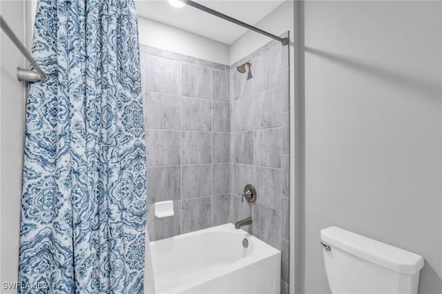 bathroom featuring toilet and shower / bathtub combination with curtain