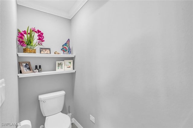 bathroom with toilet and ornamental molding