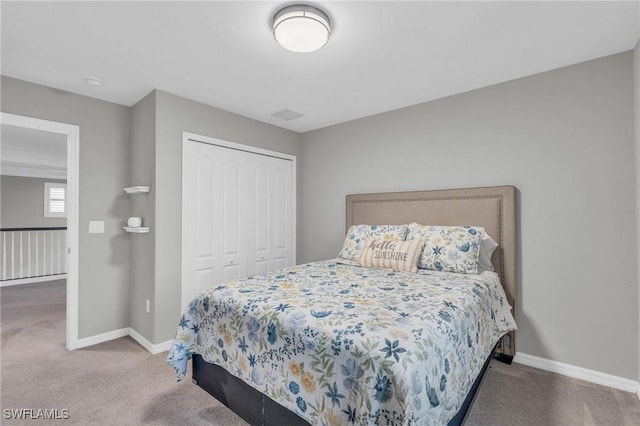 bedroom with a closet and carpet floors