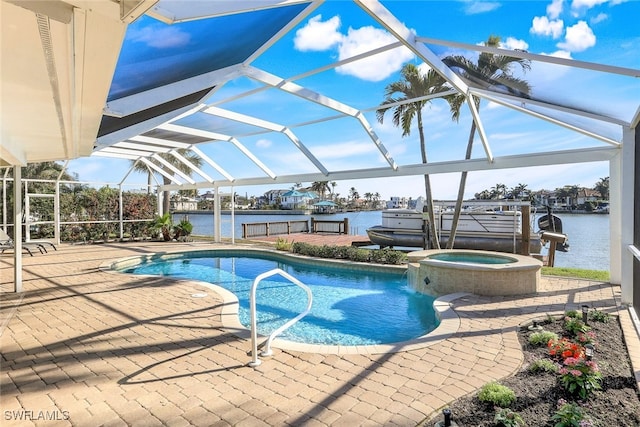 view of pool featuring an in ground hot tub, a water view, a patio area, and a lanai