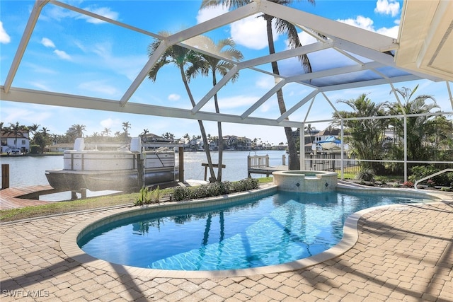 view of swimming pool with an in ground hot tub, a patio, a water view, and glass enclosure