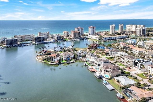 birds eye view of property featuring a water view