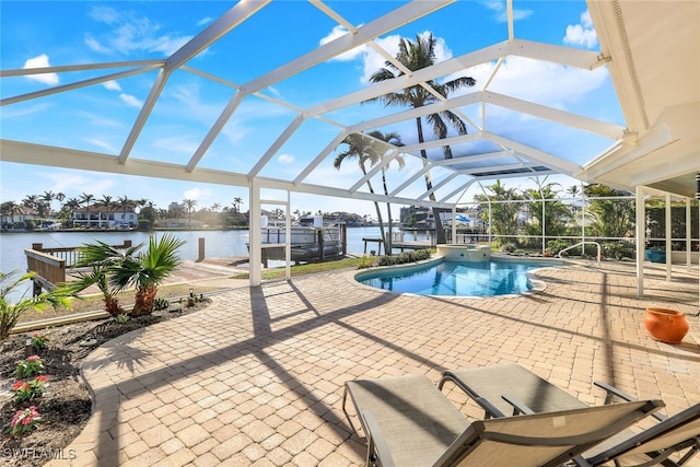 view of swimming pool featuring a lanai, a patio area, a dock, and a water view