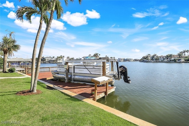 view of dock featuring a yard and a water view