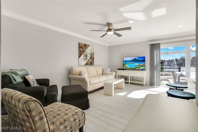 living room featuring ceiling fan and ornamental molding