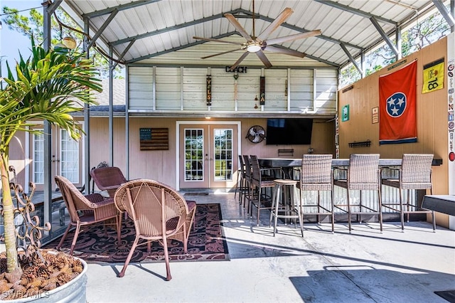 view of patio featuring ceiling fan, french doors, and an outdoor bar