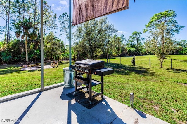 view of property's community with a yard and a patio area