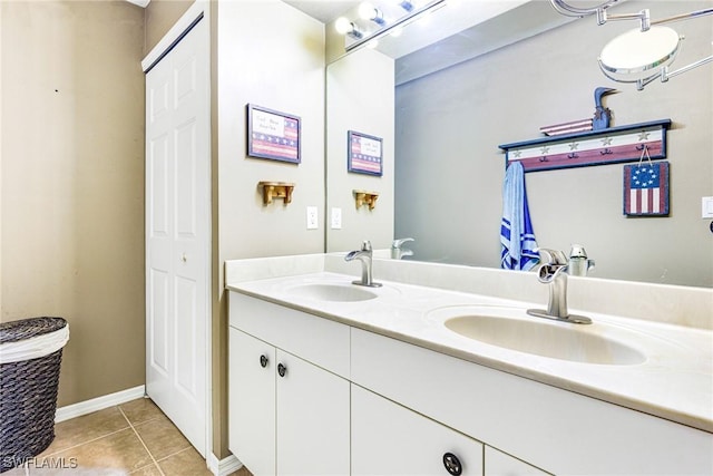 bathroom with tile patterned floors and vanity