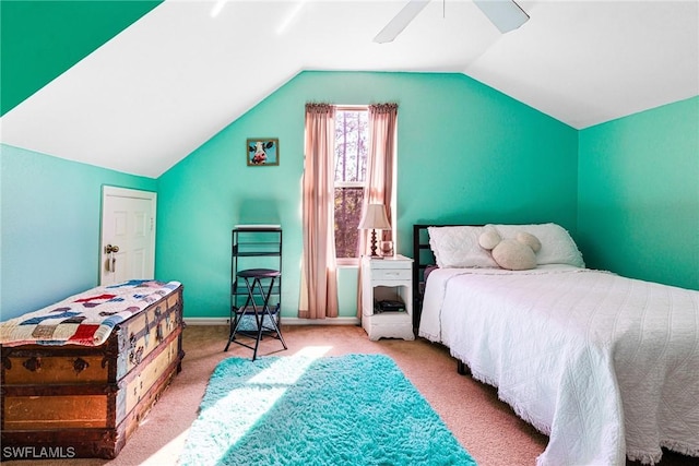 bedroom featuring vaulted ceiling, light carpet, and ceiling fan