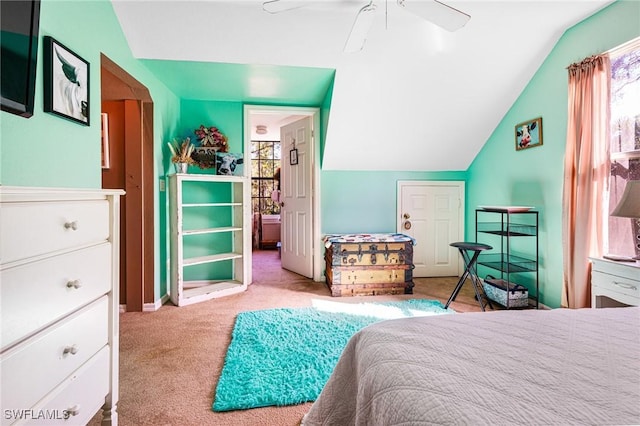 carpeted bedroom featuring lofted ceiling and ceiling fan