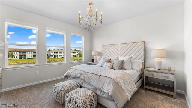 carpeted bedroom with a chandelier