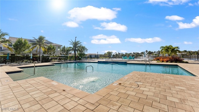 view of swimming pool with a patio