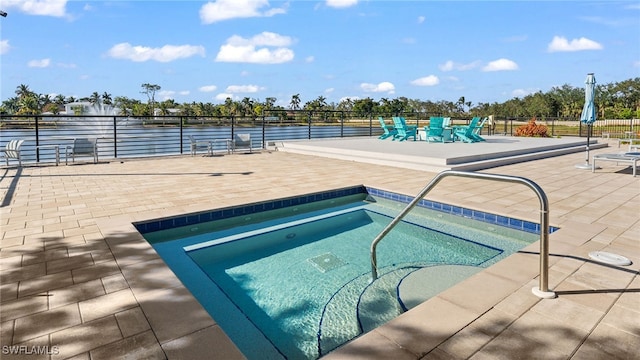 view of pool featuring a community hot tub and a patio