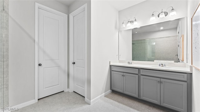 bathroom featuring vanity and a shower with shower door