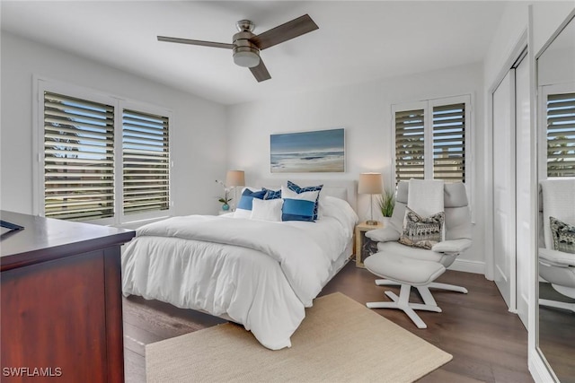 bedroom with a closet, ceiling fan, and wood finished floors