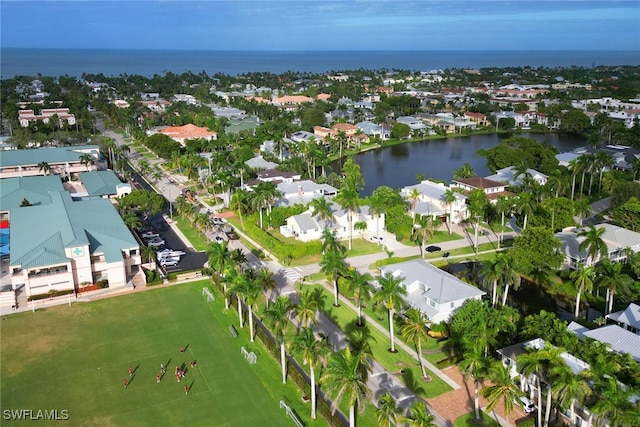 bird's eye view featuring a water view and a residential view