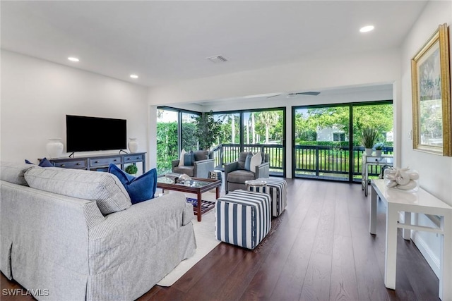 living room featuring recessed lighting, visible vents, and dark wood finished floors