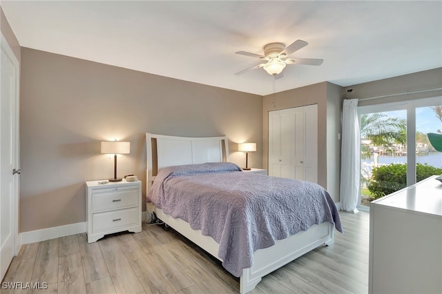 bedroom with ceiling fan, a closet, and light hardwood / wood-style floors