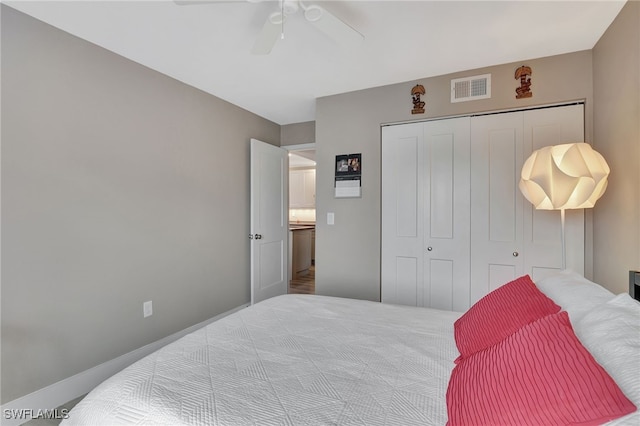 bedroom with ceiling fan and a closet