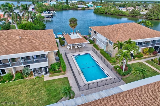 view of swimming pool featuring a water view