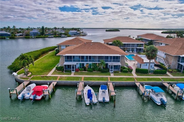 birds eye view of property with a water view