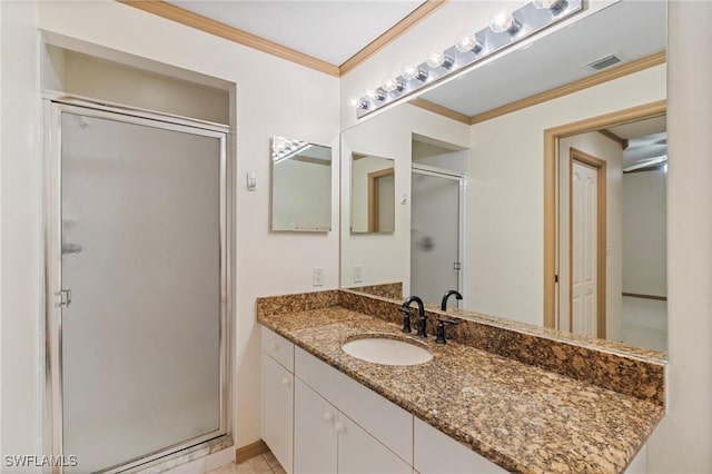 bathroom with visible vents, a stall shower, vanity, and crown molding