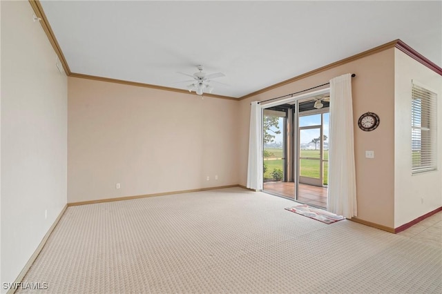 unfurnished room featuring baseboards, ornamental molding, ceiling fan, and light colored carpet