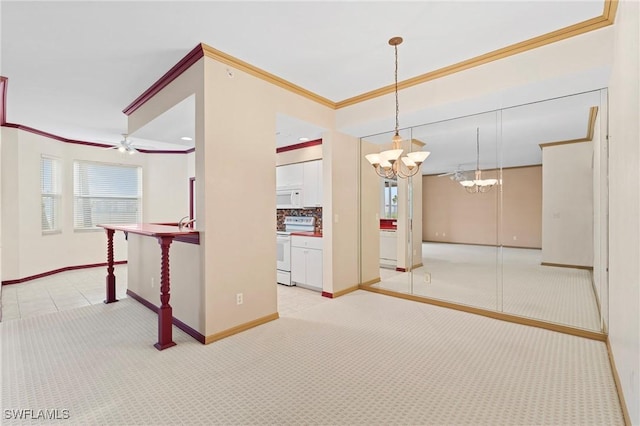 empty room featuring baseboards, ceiling fan with notable chandelier, ornamental molding, and light colored carpet