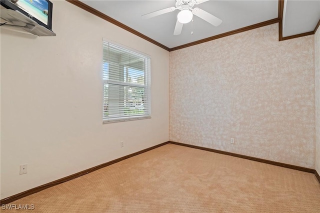 unfurnished room featuring light carpet, wallpapered walls, ornamental molding, and baseboards