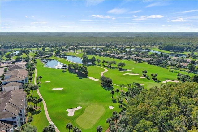 birds eye view of property with a water view and golf course view