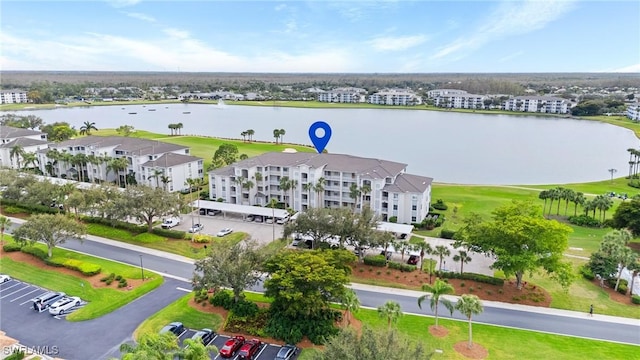 birds eye view of property with a water view