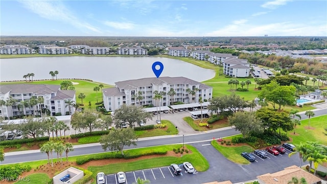 aerial view featuring a water view and a residential view