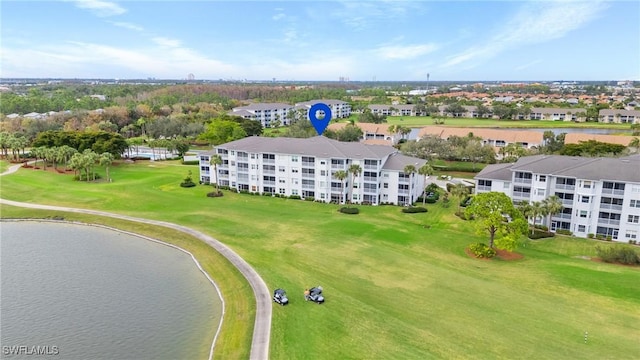 aerial view featuring a water view and view of golf course