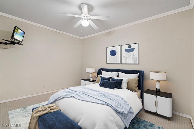 bedroom featuring baseboards, carpet floors, a ceiling fan, and crown molding