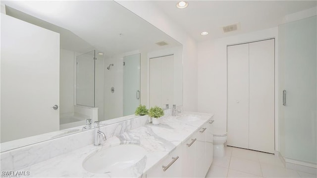 full bathroom with tile patterned flooring, vanity, toilet, and plus walk in shower