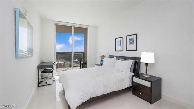 bedroom with access to exterior and floor to ceiling windows