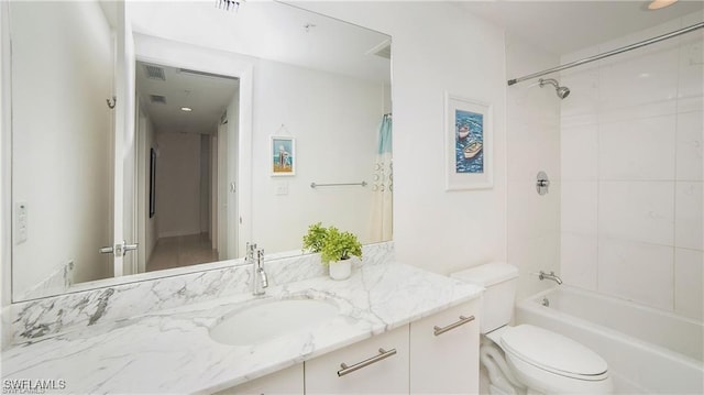 full bathroom with vanity, toilet, and tiled shower / bath