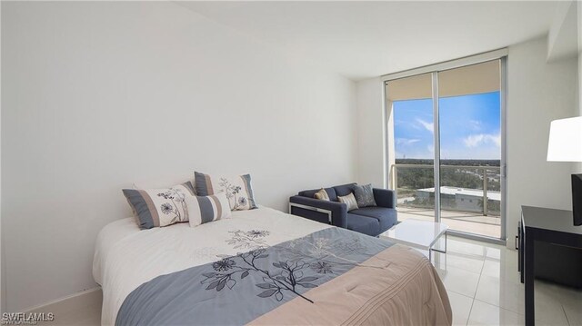 bedroom with floor to ceiling windows, light tile patterned floors, and access to outside