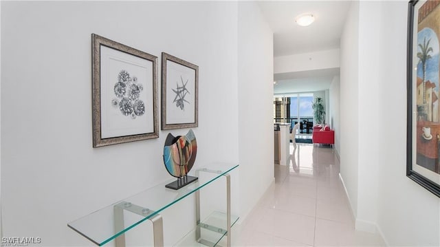 hall featuring light tile patterned floors