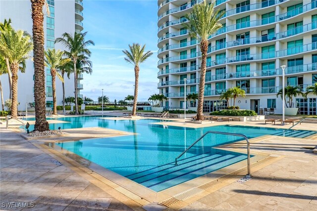 view of swimming pool featuring a patio area