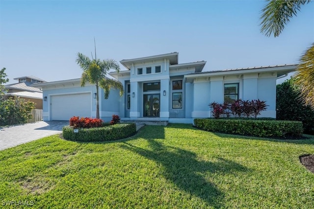 view of front facade featuring a front lawn and a garage