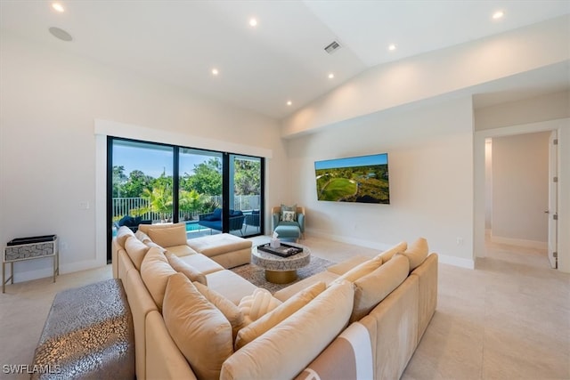 living room with high vaulted ceiling