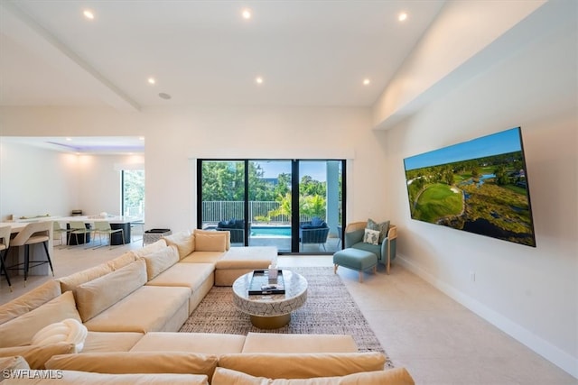 living room with a towering ceiling