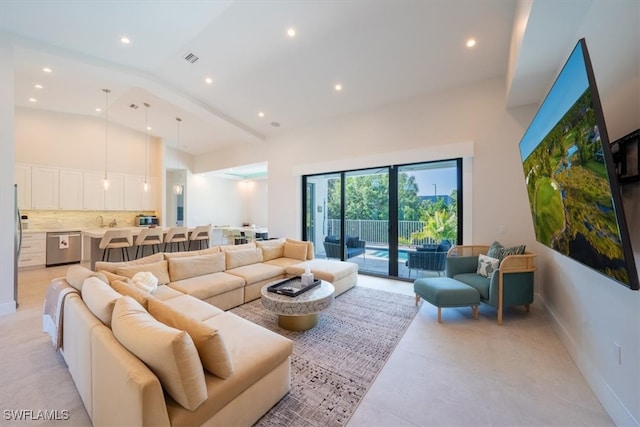 living room featuring a towering ceiling