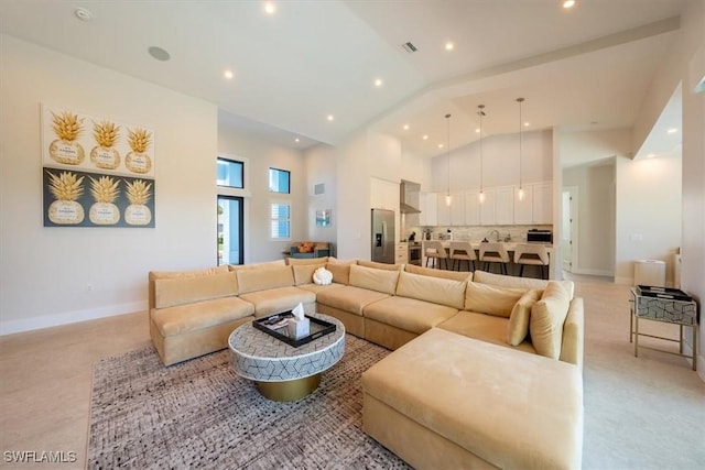 living room featuring high vaulted ceiling