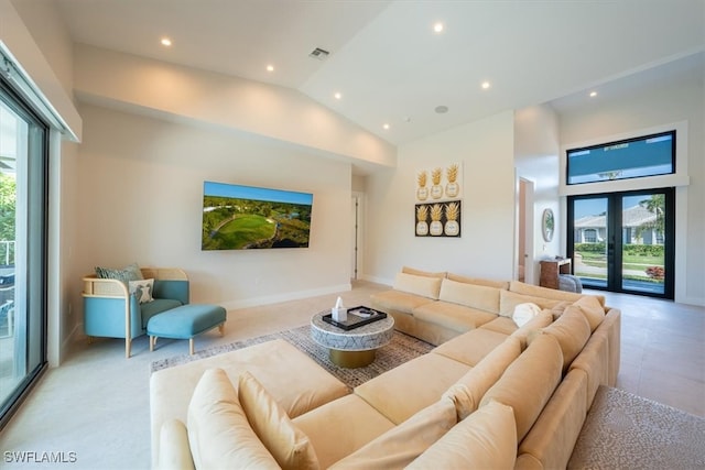 living room featuring french doors and high vaulted ceiling