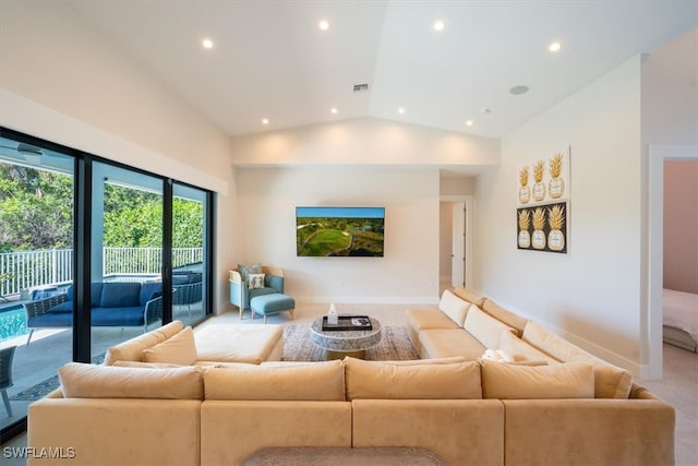 living room featuring high vaulted ceiling