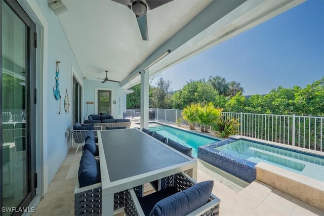 view of swimming pool with ceiling fan and a patio